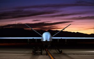 military drone with sunset in background